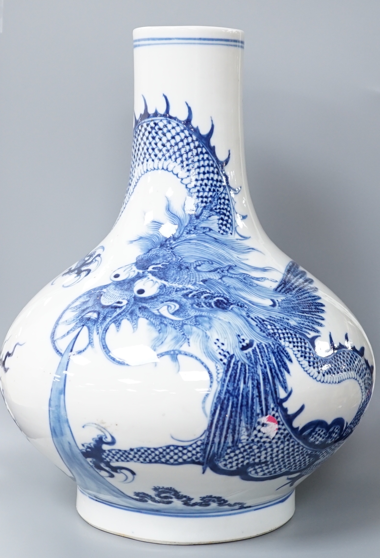 A Chinese blue and white ‘dragon’ bottle vase 32cm